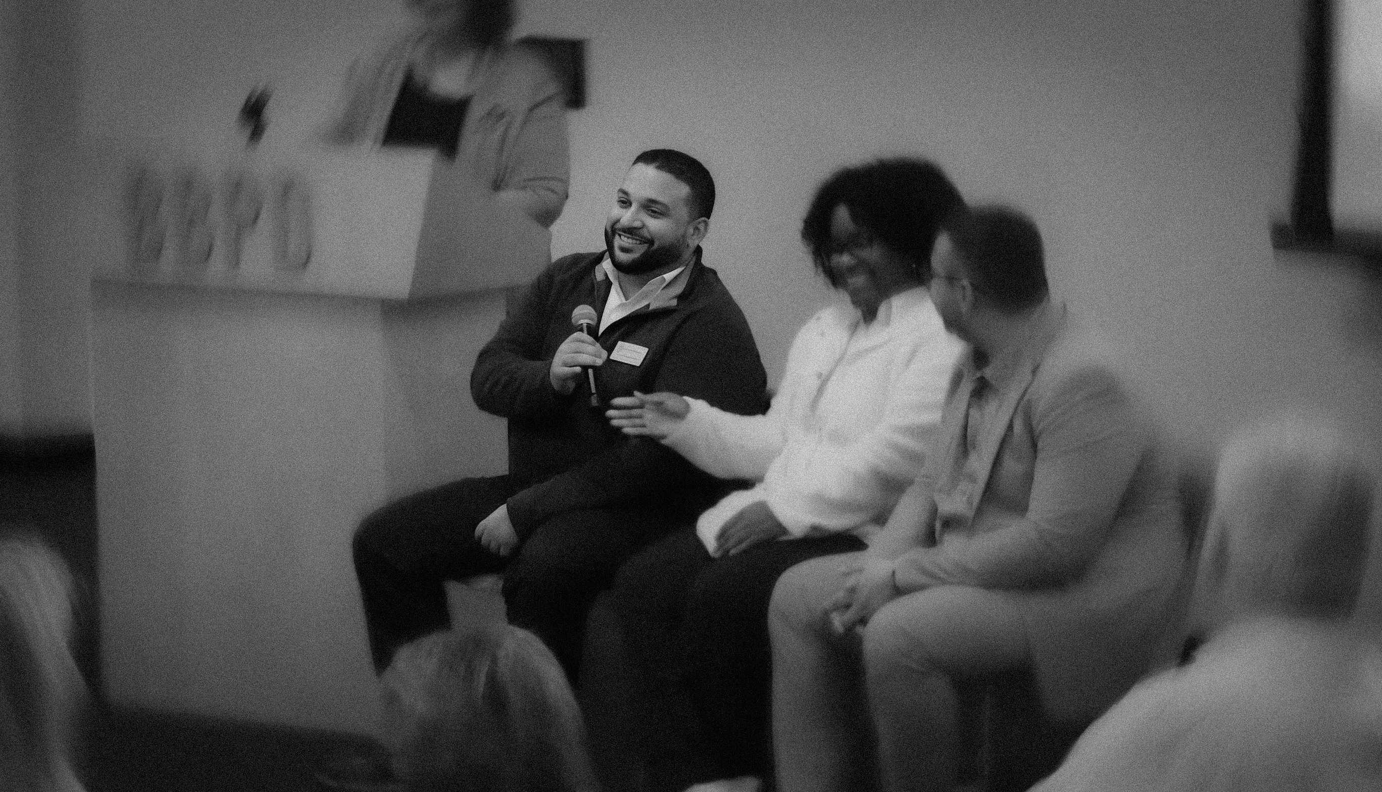 Jonathan speaking on a panel on homelessness
